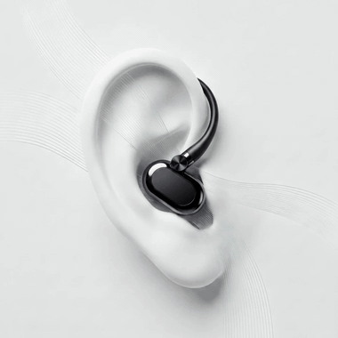 HearWell open-ear earbud resting outside the ear canal with animated airflow lines